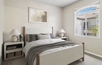Model Bedroom with Carpet and Window View at Reserve at Rancho Apartments located in Moreno Valley, CA.