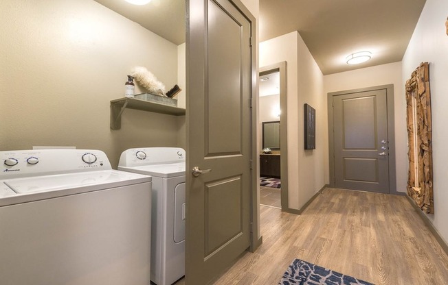 Laundry room with individual washers and dryers in apartments