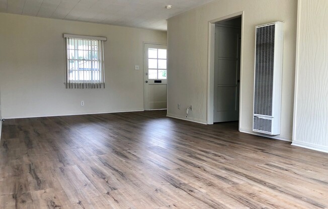 Quaint Midtown Home with New Wood Flooring & Large Yard!!
