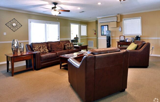 a living room with couches and a table