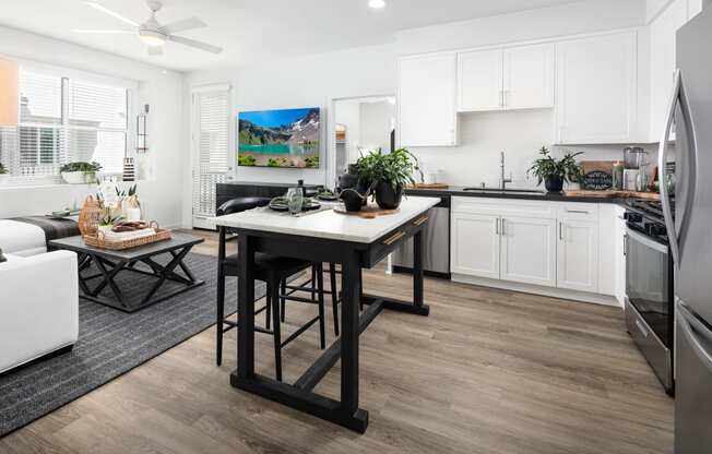 a kitchen and living room with a large center island at Solstice at Fiddyment Ranch, California