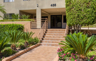 the stairs up to the entrance of an apartment building