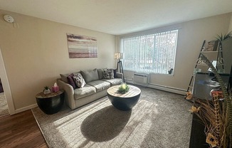 a living room with a couch and a table