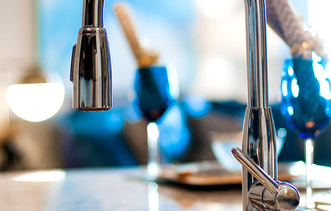 a close up of a kitchen sink with a faucet