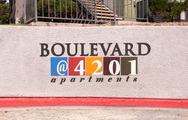 a sign on the side of a building that says boulevard a 441 apartments