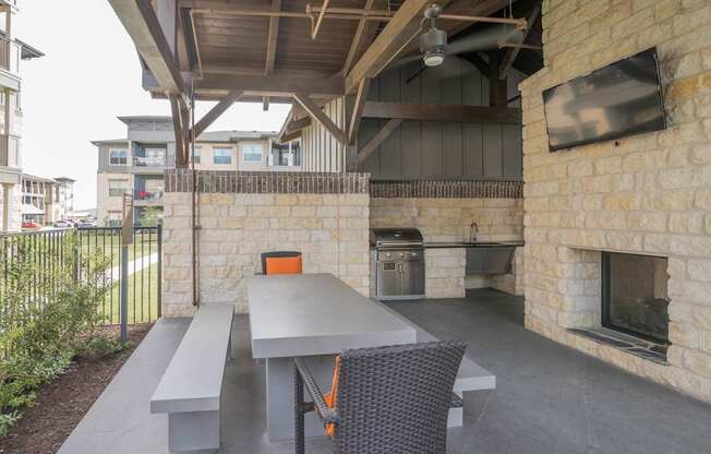 A patio with a table and chairs is shown.
