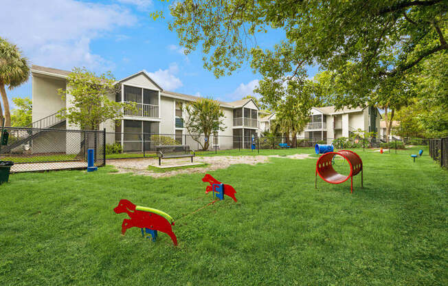 Dog park with agility equipment at Vue at Baymeadows Apartments in Jacksonville, Florida