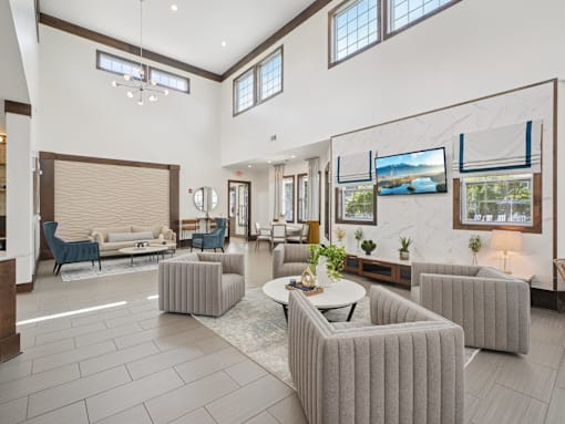 Modern resident clubhouse and luxury community lounge at Village at Broadstone Station apartments in Apex, NC