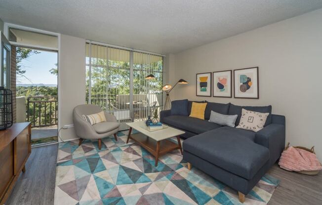 Spacious living room with natural lighting and balcony access