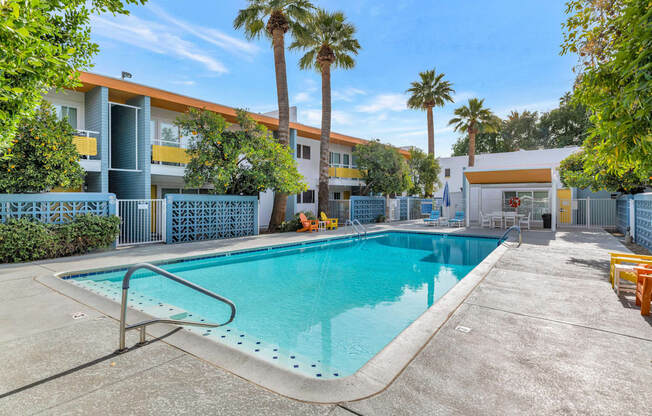 A swimming pool in a sunny outdoor setting. at The Phoenix Apartments on 6th Avenue, Phoenix 85013