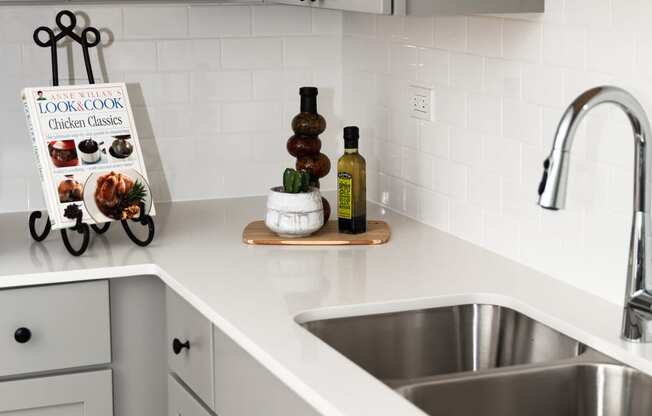 Sink With Faucet at Winfield Station Apartments, J Street Property Services, Winfield, IL, 60190