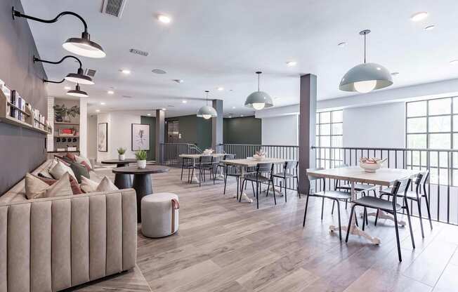 Two-story social area with abundant seating and natural light at Novel Cary