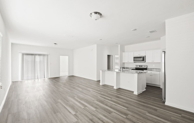 living room with open kitchen and a big window