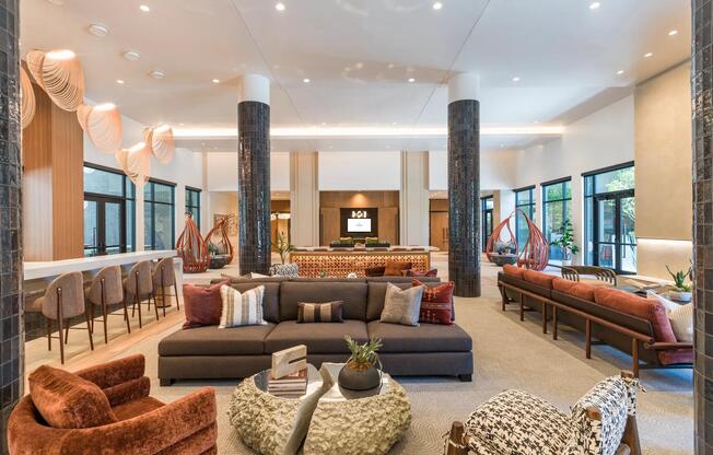Sophisticated resident lounge featuring designer lighting, eclectic seating, and refined spaces to work, relax, or connect.