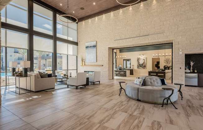 A modern living room with a large window and a couch.