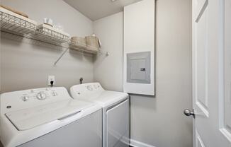 a white washer and dryer in a room