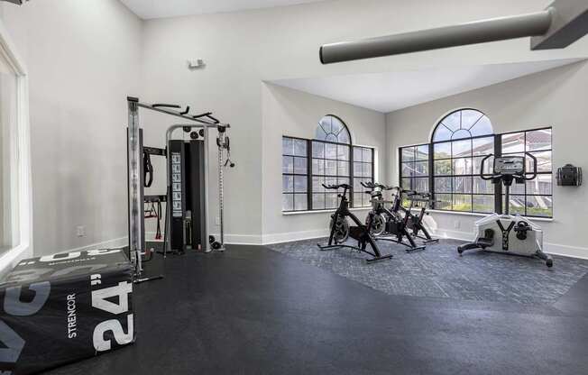 A spacious home gym with a variety of exercise equipment.
