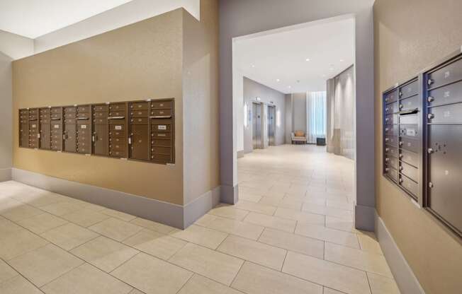 a view of a hallway with mailboxes in a lobby at The Merc, Waltham, Massachusetts