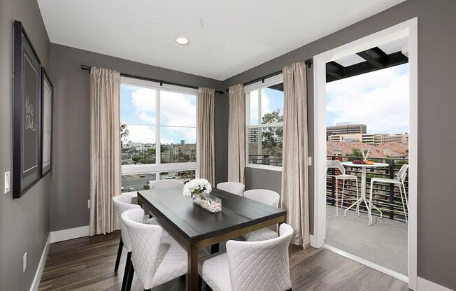 a dining room with a table and chairs