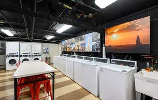 A laundry facility with large hanging photos in Old Town, Alexandria, VA.