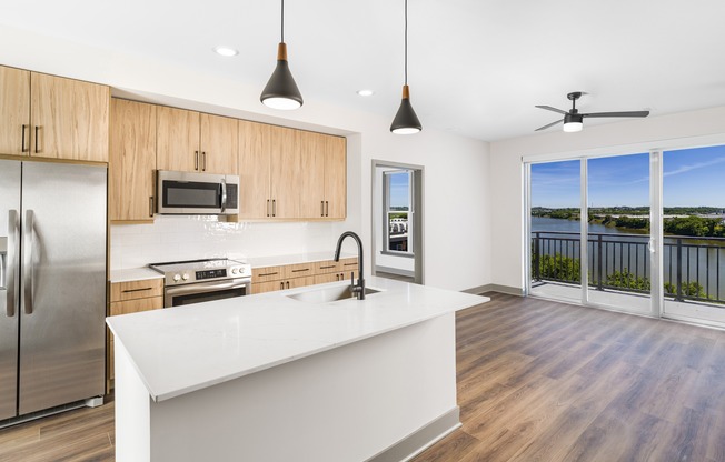 Enjoy culinary convenience at Modera Riverview with a spacious chef’s island featuring built-in storage.