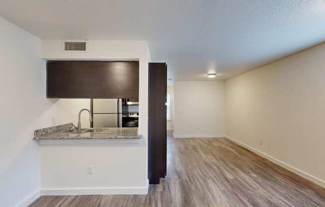 a kitchen and dining area in a 555 waverly unit at Bennett Ridge Apartments, Oklahoma City