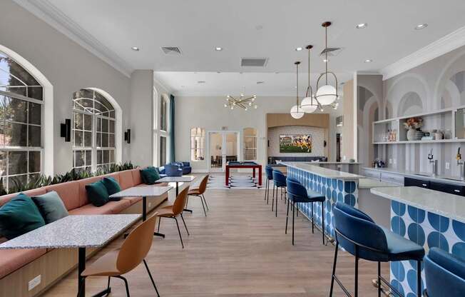 Clubhouse with tables and chairs and a bar