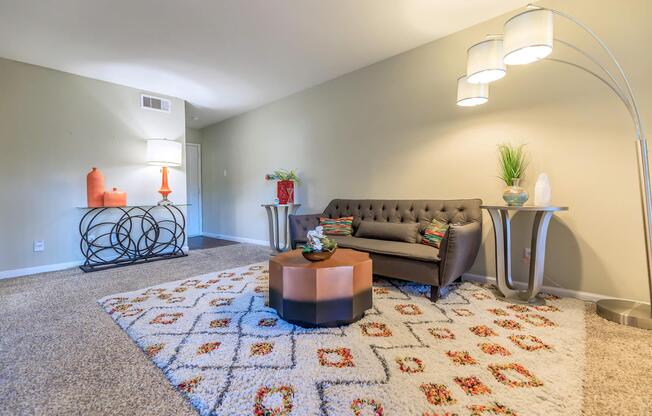 a living room filled with furniture and a flat screen tv