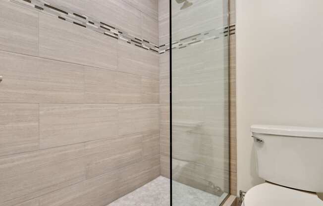 Bathroom with shower stand, glass door