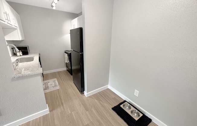 a kitchen and dining area in a 555 waverly unit