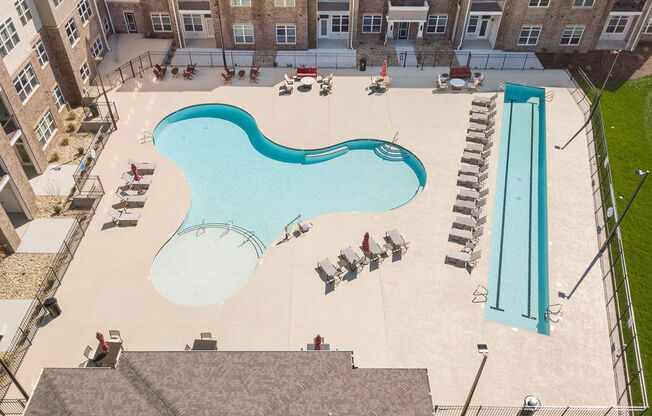 a view of a swimming pool from the roof of a building