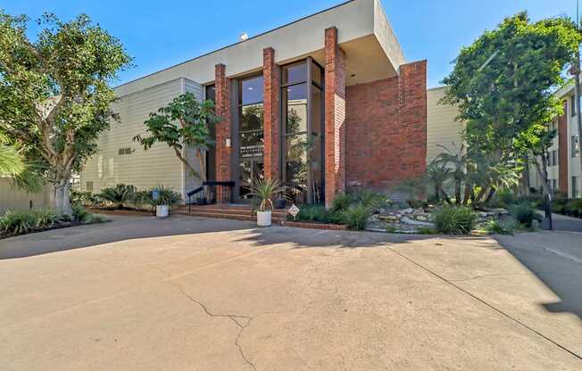 A modern building with a large front door and a brick facade.