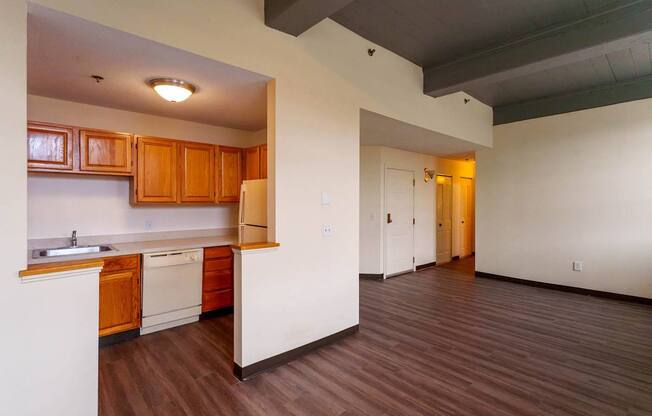 A kitchen with wooden cabinets and a white countertop.