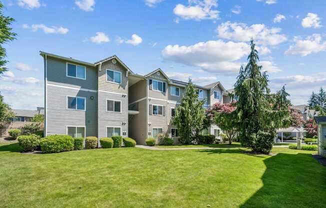 A row of apartments with landscaping in front at The Madison apartments in Olympia, WA