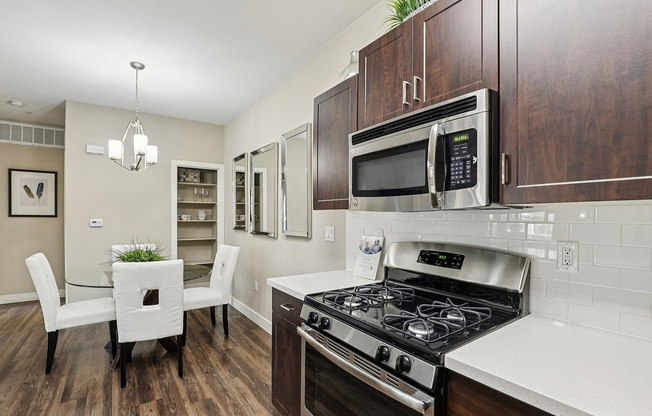 Wood Cabinets, White Quartz Countertops, Shelved Closet