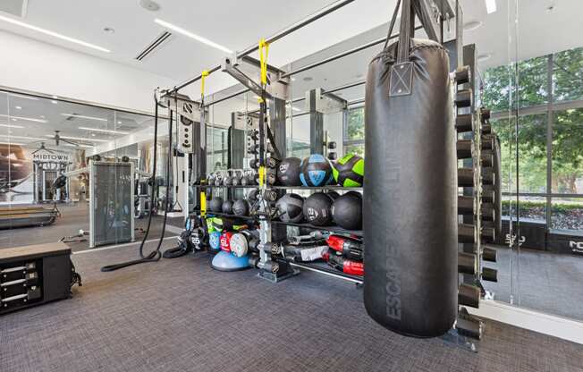 a large punching bag hangs in the corner of a gym