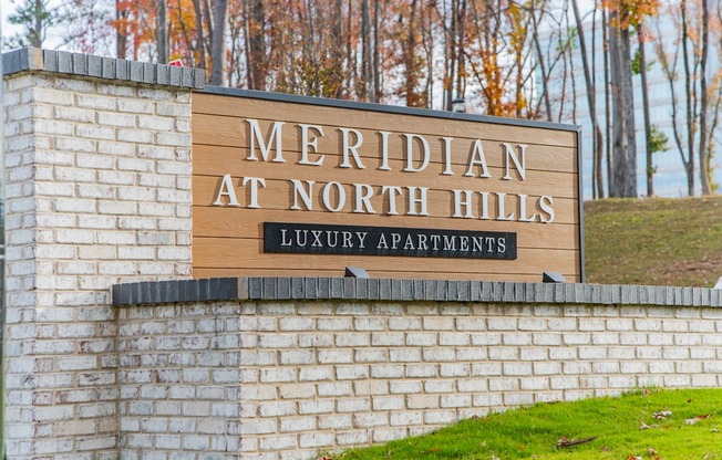 A sign for Meridian at North Hills Luxury Apartments is displayed.