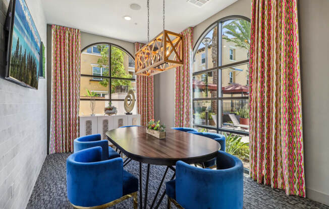 conference room with a table and chairs and large windows