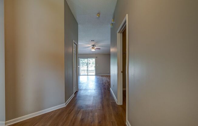 Freshly Updated 3 bedroom / 2 bath Gem with Pond Views, Luxe Flooring & Sleek Finishes in Spencer's Plantation!!!