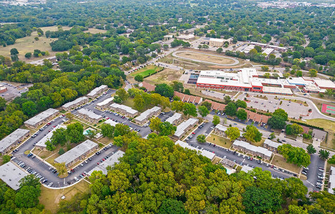 an aerial view of a city with buildings and trees