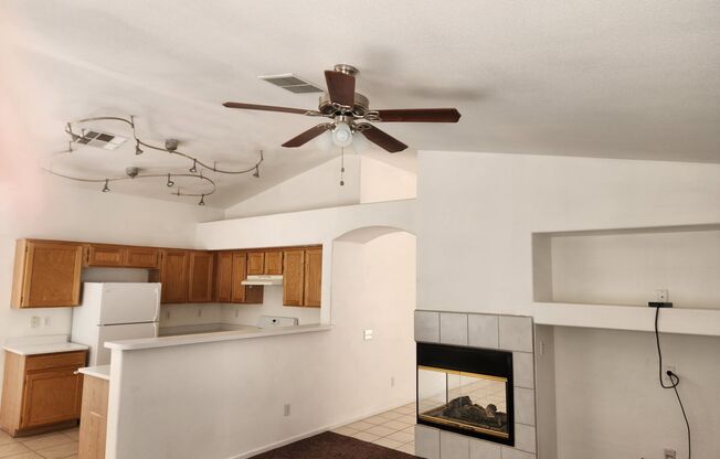 Single story with tile flooring and gas fireplace.