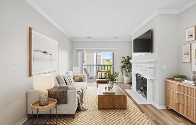 Living room with a fireplace in select homes, private balcony access, and abundant natural light that enhances everyday comfort and relaxation.
