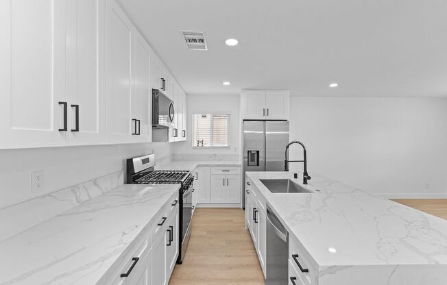 Spacious 4 Bed / 3 Bath Home with Private Driveway, In-Unit Laundry