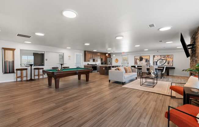 a clubhouse with a pool table and a living room