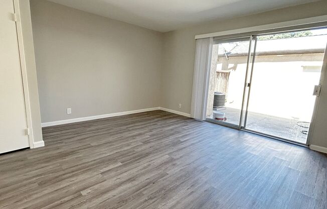 Move-in ready Evergreen townhome with private backyard, detached 2-car garage, and great community amenities