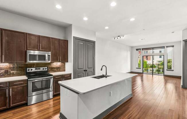 A modern kitchen with wooden cabinets and a white island.