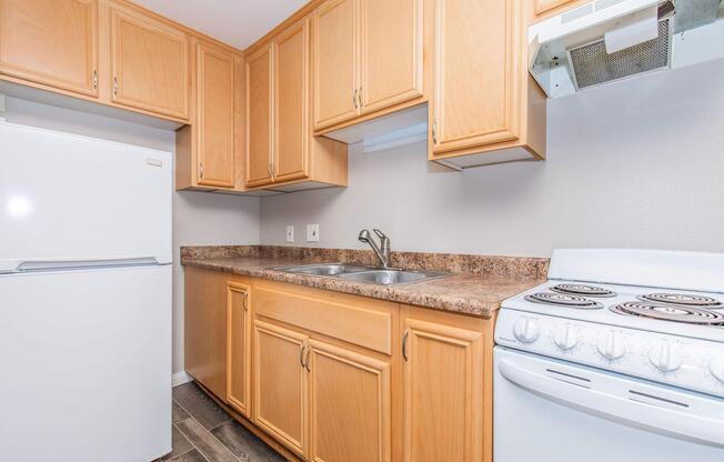 a kitchen with a stove and a refrigerator