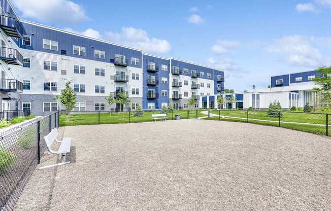 A playground area in front of apartment buildings.