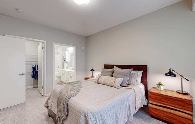 a bedroom with a bed and two night stands