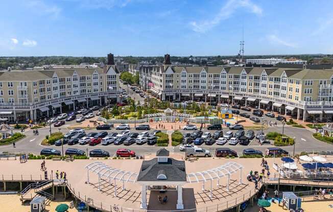 A large round building with a stage in the middle of a parking lot.